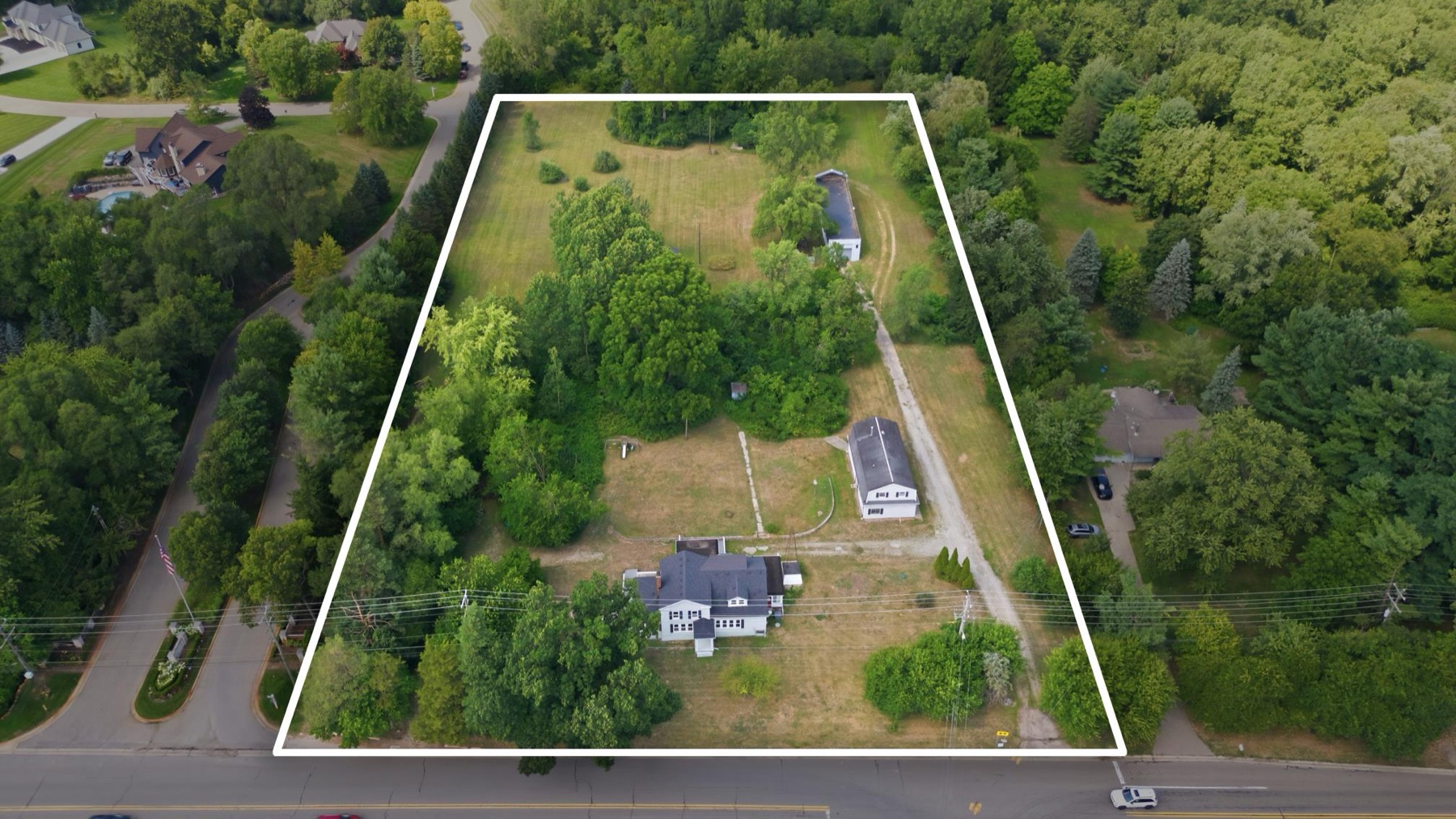 Drone photograph of a large parcel in Commerce Township, MI with the property boundary outlined