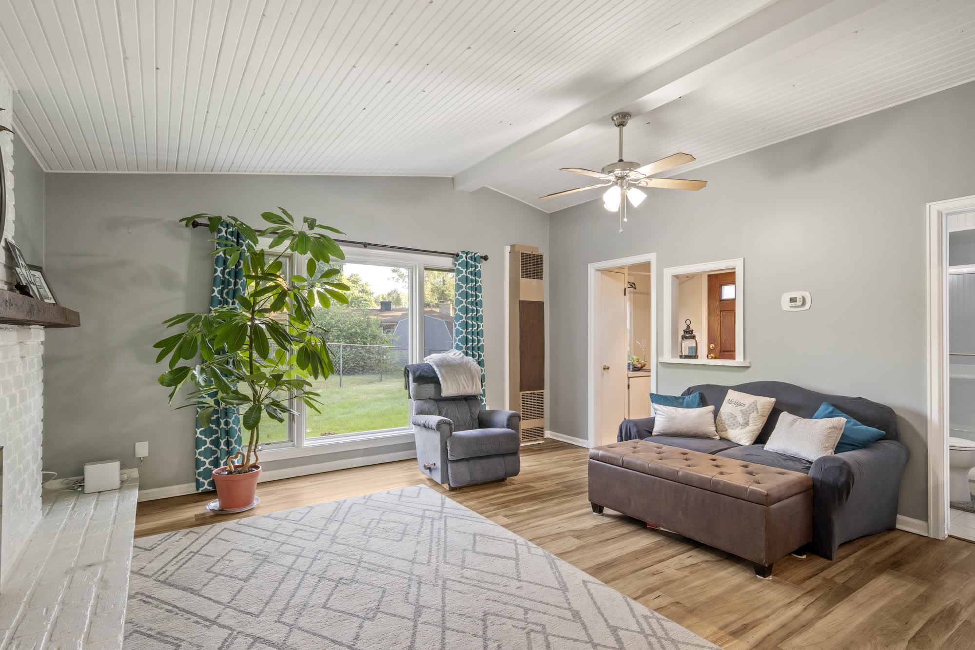 The living room of the same home photographed on a second visit in fall