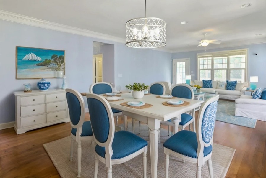 A dining room virtually staged in a coastal style