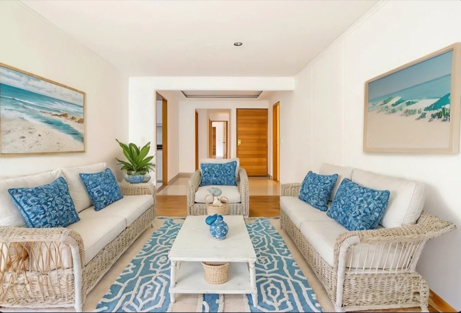 A living room virtually staged in a coastal style