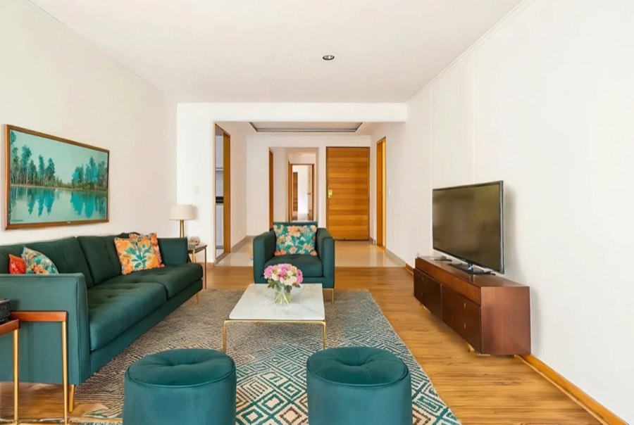 A living room virtually staged in a mid-century style