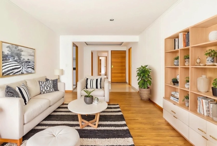 A living room virtually staged in a scandinavian style