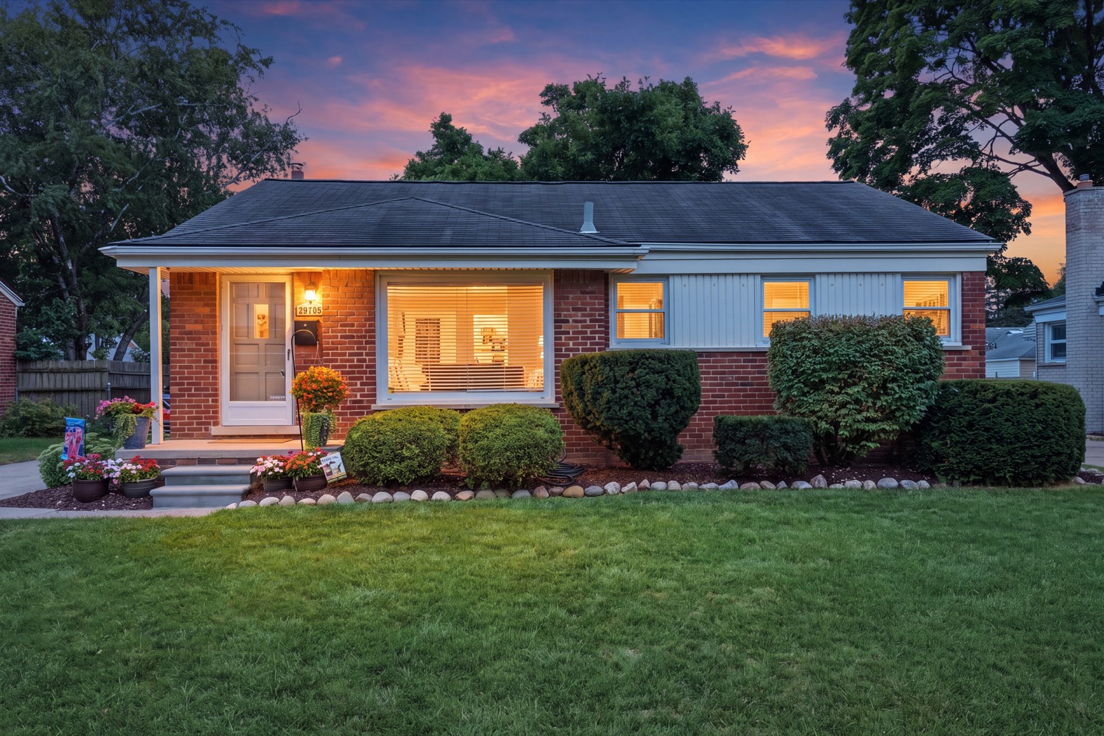 Twilight listing photograph of a brick ranch home in Metro Detroit