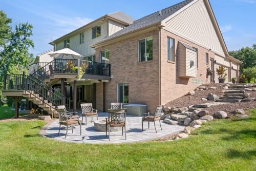 exterior photography backyard sunny day blue sky replacement patio deck residentail photography leverage michigan novi northville canton livonia belleville