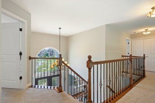 stairs hallway showcase high ceilings bedrooms door residential real estate photography leverage south lyon novi northville livonia canton westland michigan